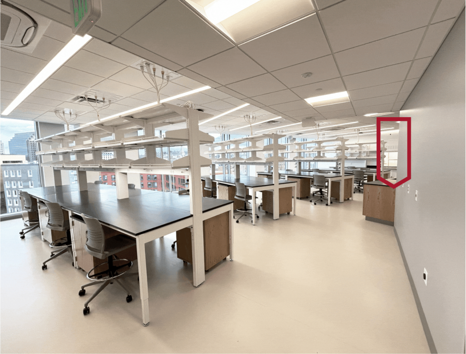 Where is my fume hood??? Photo of a lab with benches and one fume hood in the far back of the room